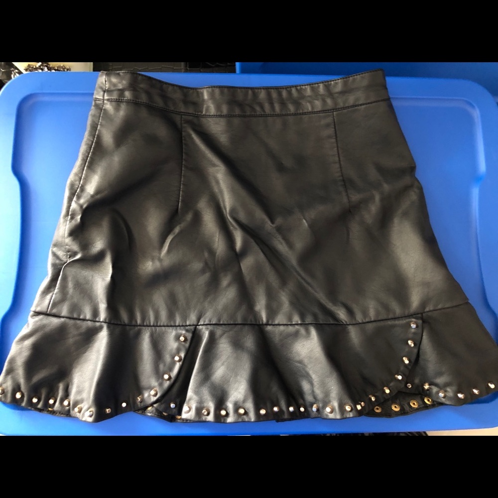 Black leather skirt with gold studs